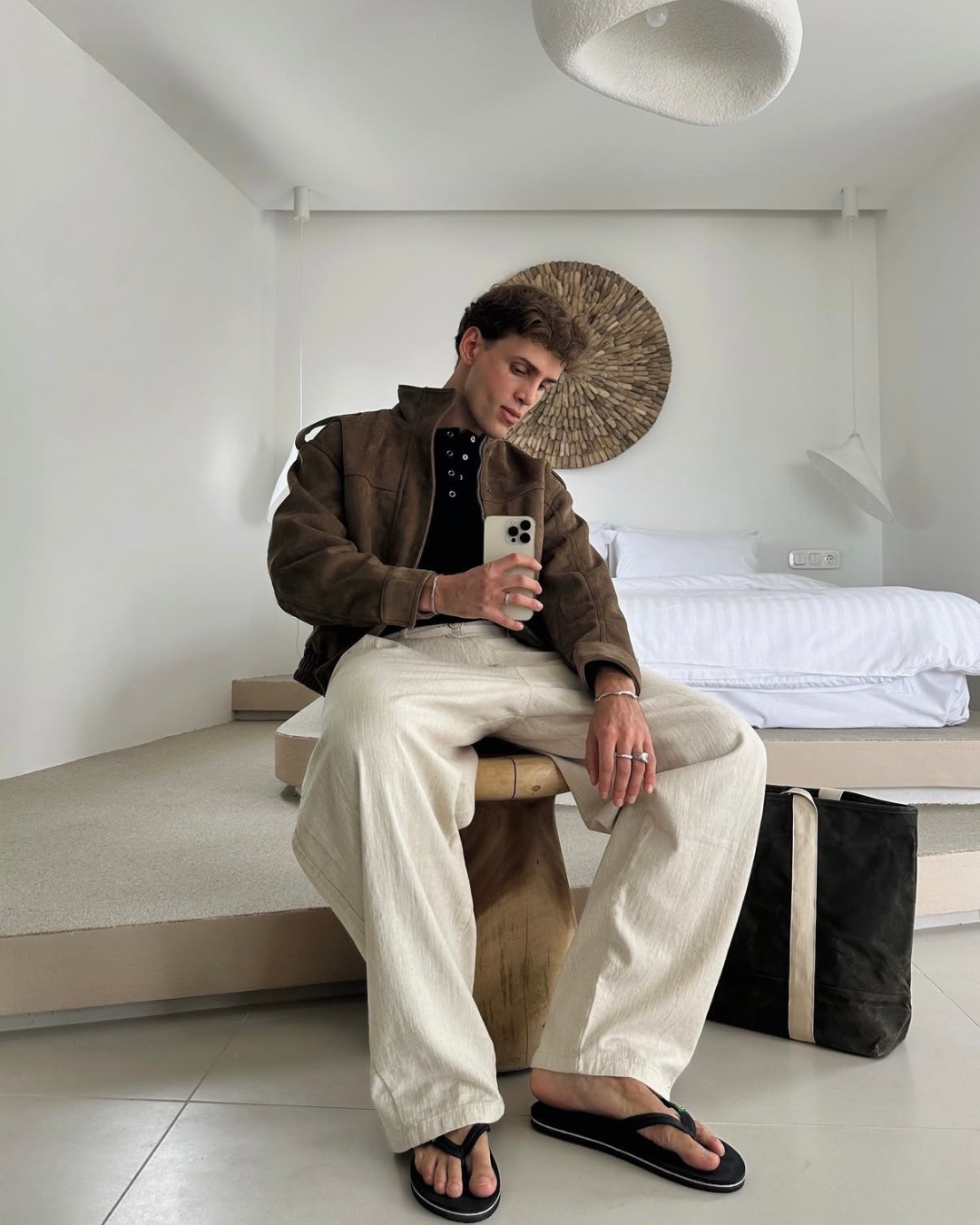 man selfie in a luxurious hotel greece vibes swearing monateo jewelry
