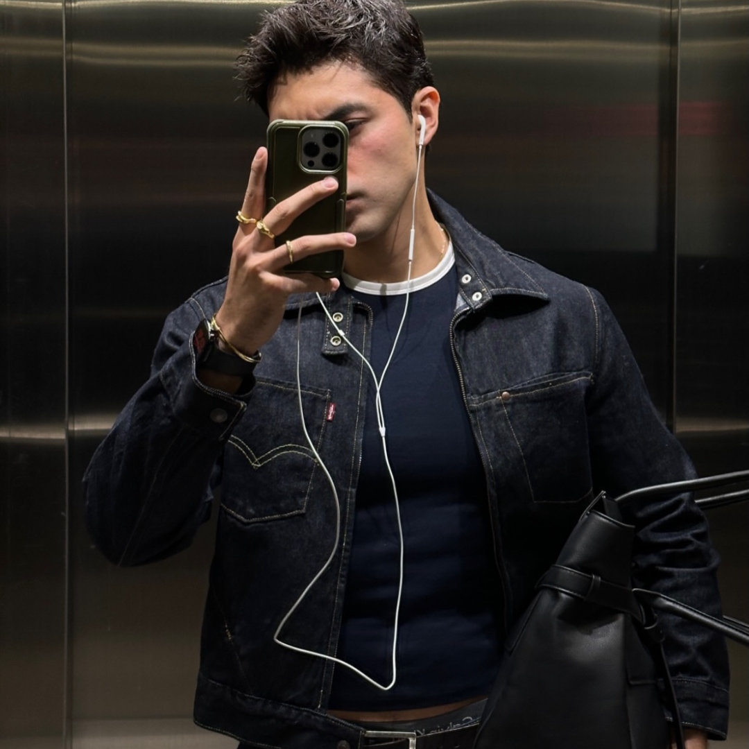 men wearing monateo jewelry in elevator