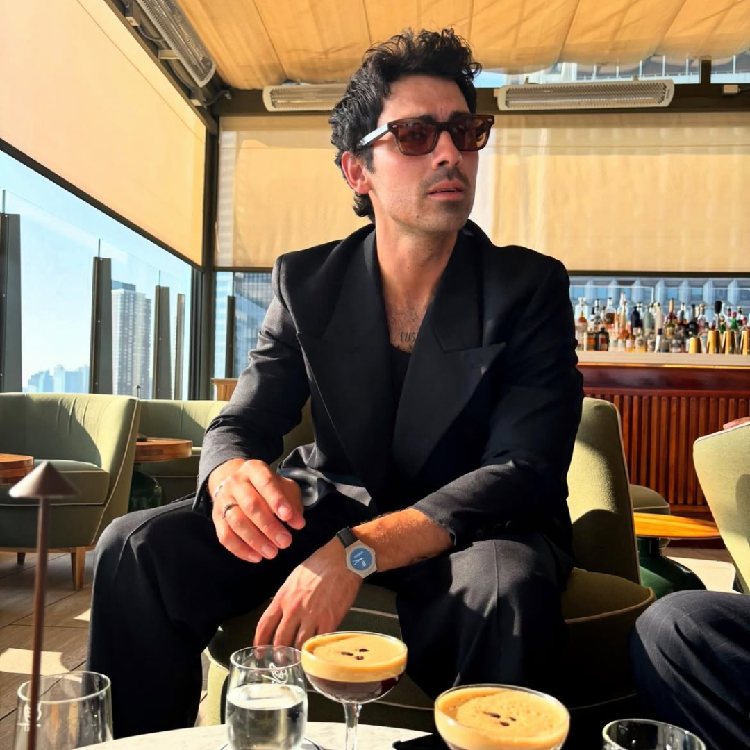 Joe Jonas wearing monateo jewlery in a bar