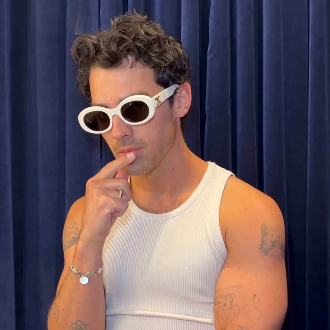 Joe Jonas wearing sunglasses and monateo jewelry